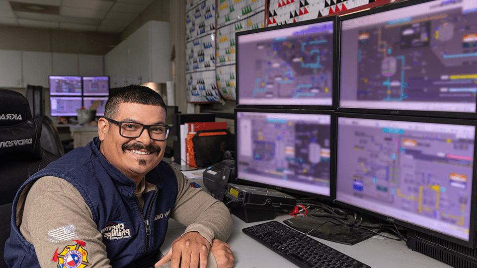 Operator smiling at console